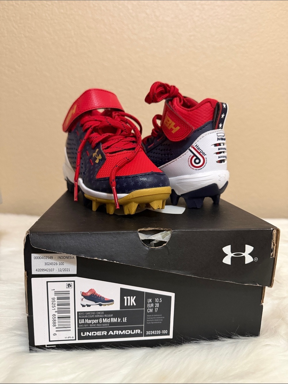 Under Armour Kids Red and Navy Football Cleats with Gold Accents